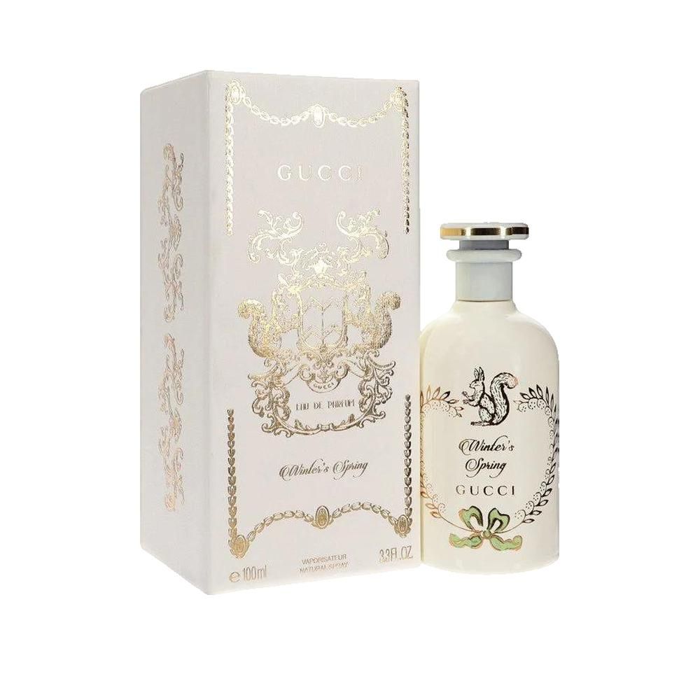 Gucci Parfumflakon und Verpackung. Weiß mit goldenen Verzierungen. Aufschrift: Winter's Spring, Gucci.