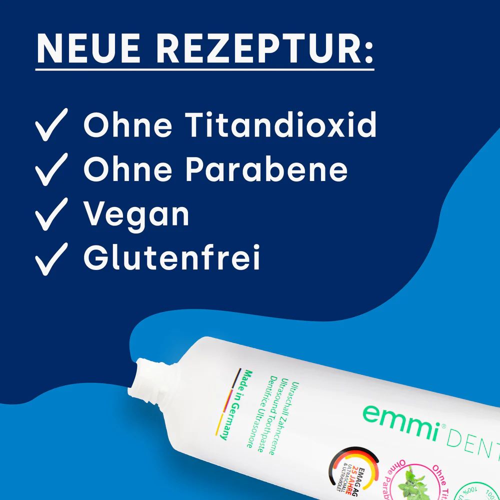Zahnpasta-Tube. Aufschrift: emmi-dent. Neue Rezeptur: Ohne Titandioxid, Parabene, Vegan, Glutenfrei.
