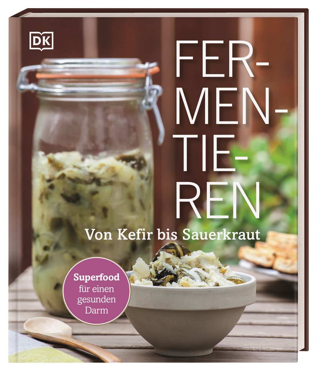 Buchcover mit Glasgefäß und Schüssel mit Fermentiertem. Titel: Fermentieren. Untertitel: Von Kefir bis Sauerkraut. Logo: DK.