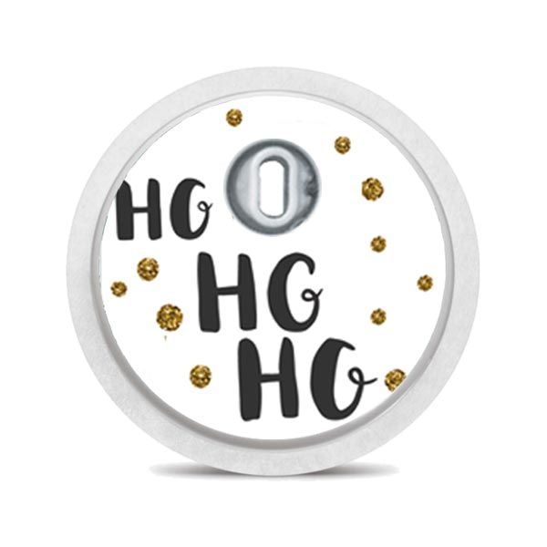 Runder Sticker mit 'HO HO HO' Schriftzug und goldenen Punkten. Weißer Rand.