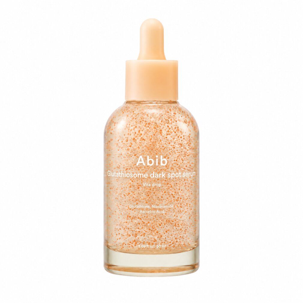 Abib Glutathione Dark Spot Serum Flasche mit Pipettenaufsatz. Enthält kleine orange Partikel.