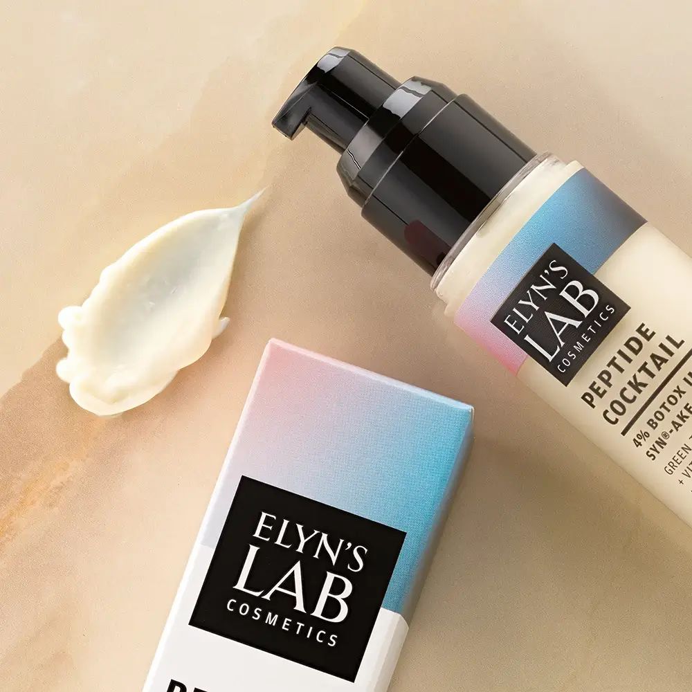 Gesichtspflege-Tube mit Spender und Creme-Klecks. Verpackung mit Markenlogo. Marke: Elyn's Lab.
