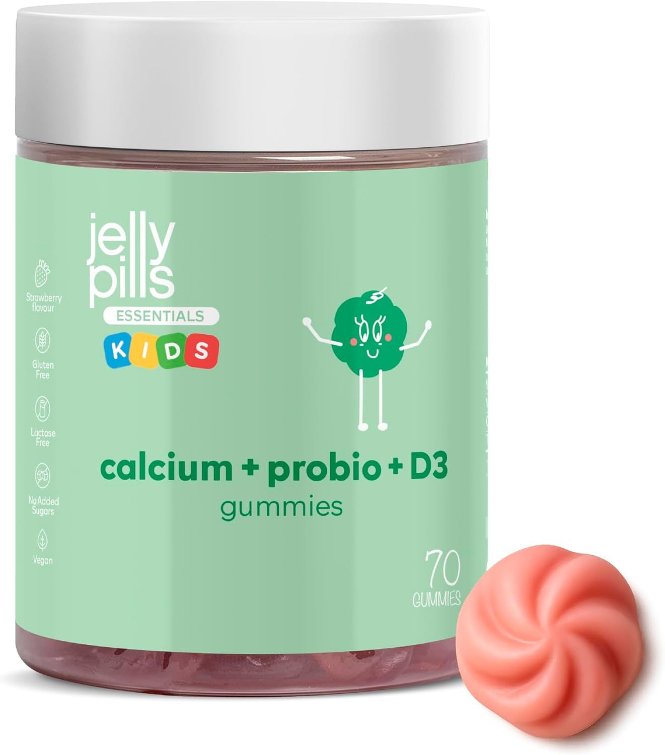 Grünes Glas mit Aufschrift 'Jelly Pills Essentials Kids Calcium + Probio + D3 Gummies'. Eine Gummibärchen daneben.