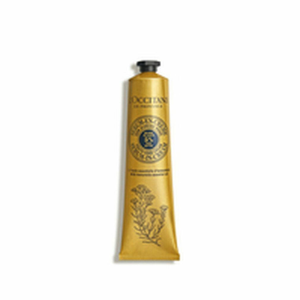 Goldfarbene Tube mit schwarzem Deckel. Aufschrift: L'Occitane en Provence, Serum-en-Crème, 5% Shea Butter. Illustrationen.