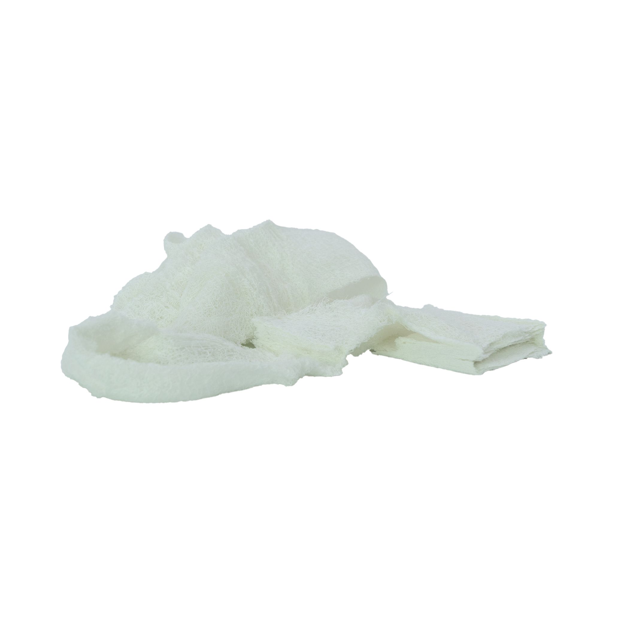 Weißes, entfaltetes, komprimiertes Gaze-Pad. Produkt: WERO MED-X® TACTICAL COMPRESSED GAUZE®.