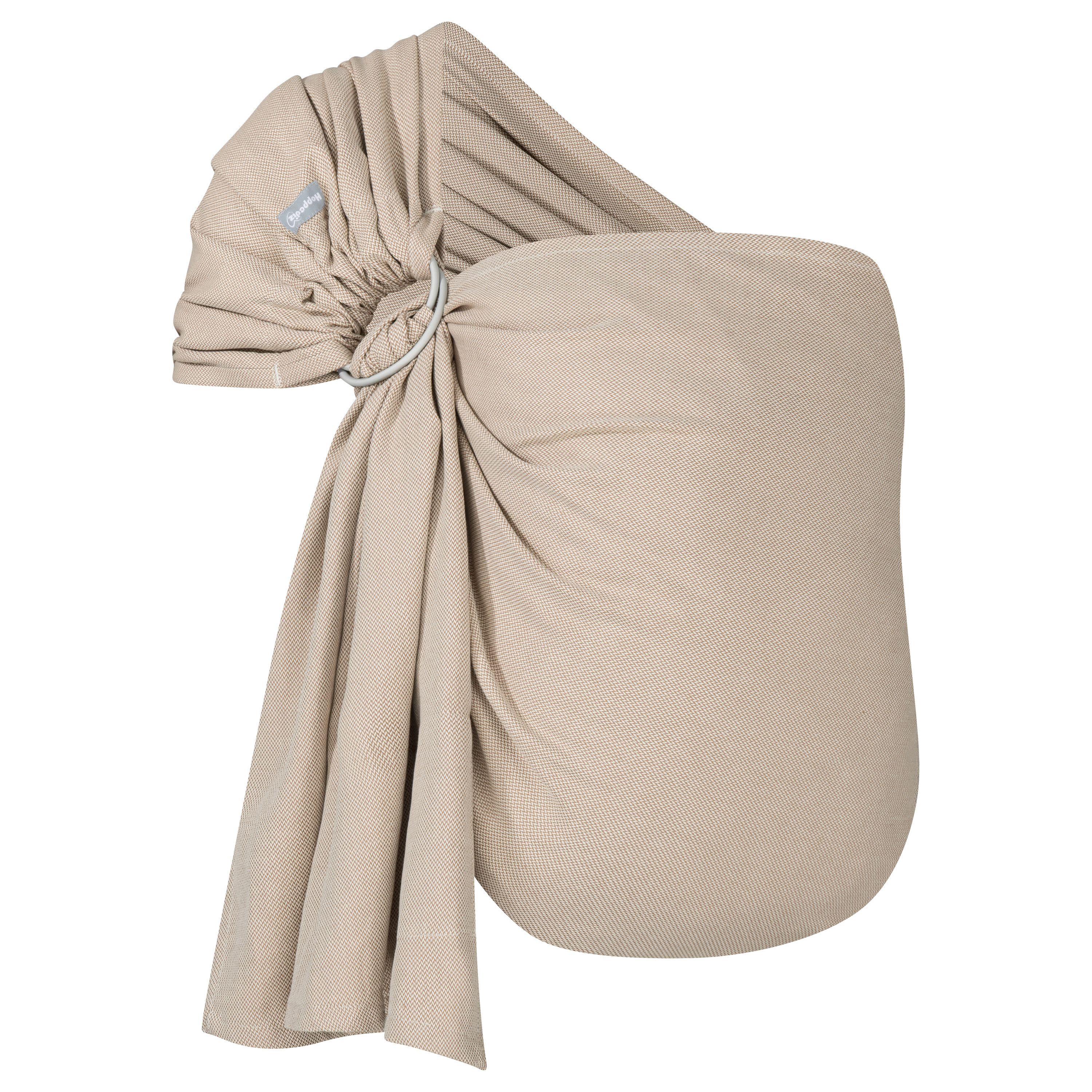 Ring-Sling aus beigem Stoff. Metallring zur Befestigung. Label am Stoff. kbA-Zertifizierung.