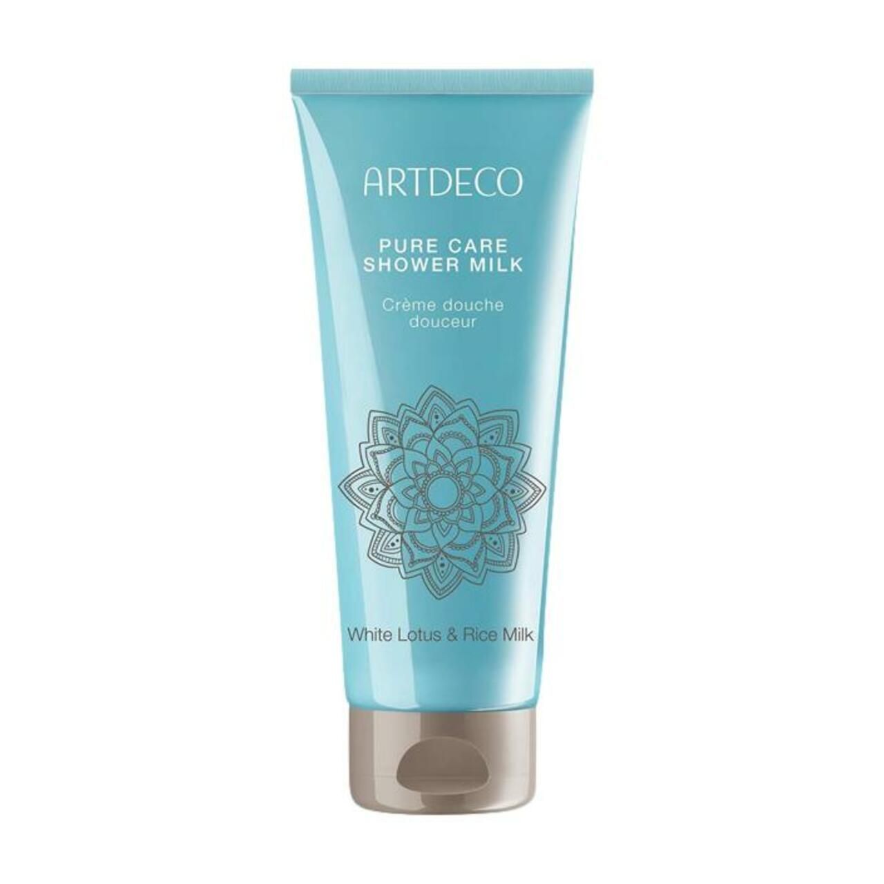 Hellblaue Tube mit Produktnamen ARTDECO, Pure Care Shower Milk. Aufdruck: Creme douche douceur, White Lotus & Rice Milk. Beige Verschluss.