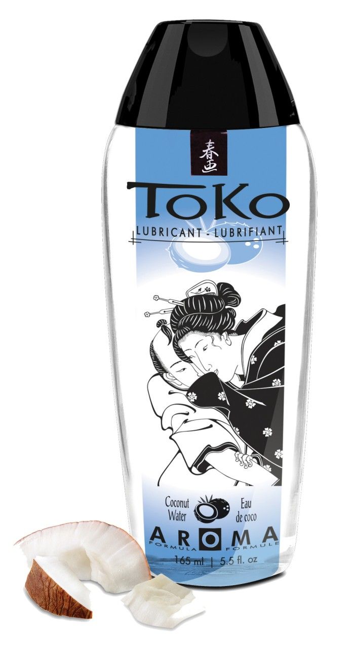 ToKo Aroma Kokoswasser Gleitmittel in transparenter Flasche mit schwarzem Verschluss. Kokosnussstücke daneben.