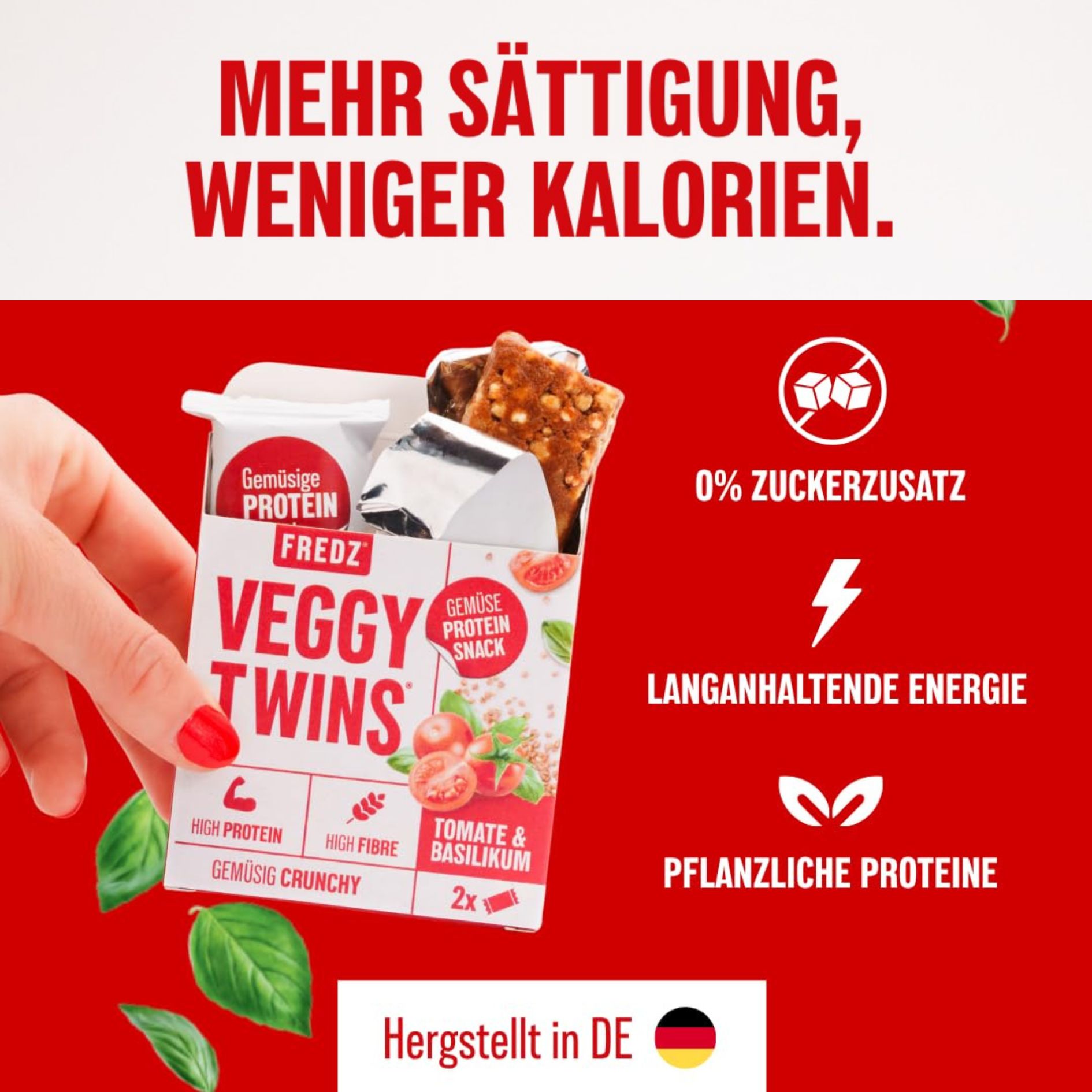 Verpackung mit FREDZ VeggyTwins®-Gemüse Proteinsnack. Enthält zwei Riegel. Aufschrift: Tomate & Basilikum, High Protein, High Fibre.