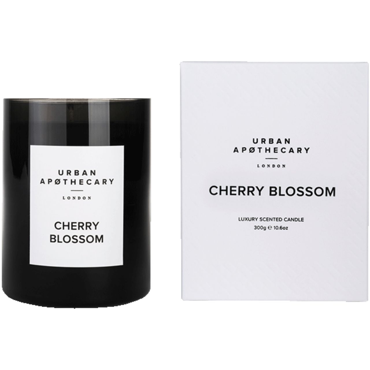 Schwarze Kerze und Verpackung. Aufschrift: Urban Apothecary London, Cherry Blossom. Luxuriöse Duftkerze.