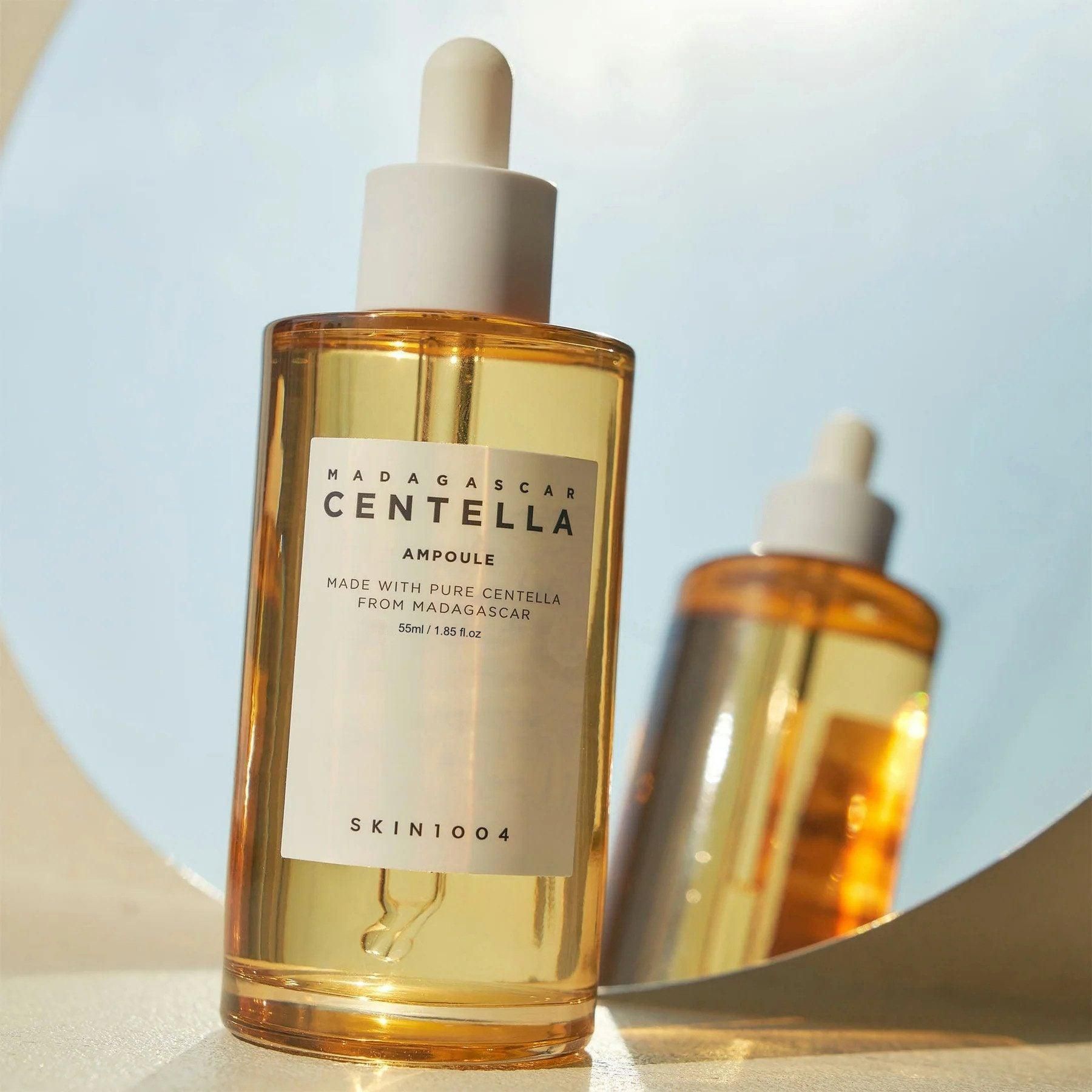 Glasflasche mit Pipette, gefüllt mit gelber Flüssigkeit. Etikett mit 'Centella Ampoule'.