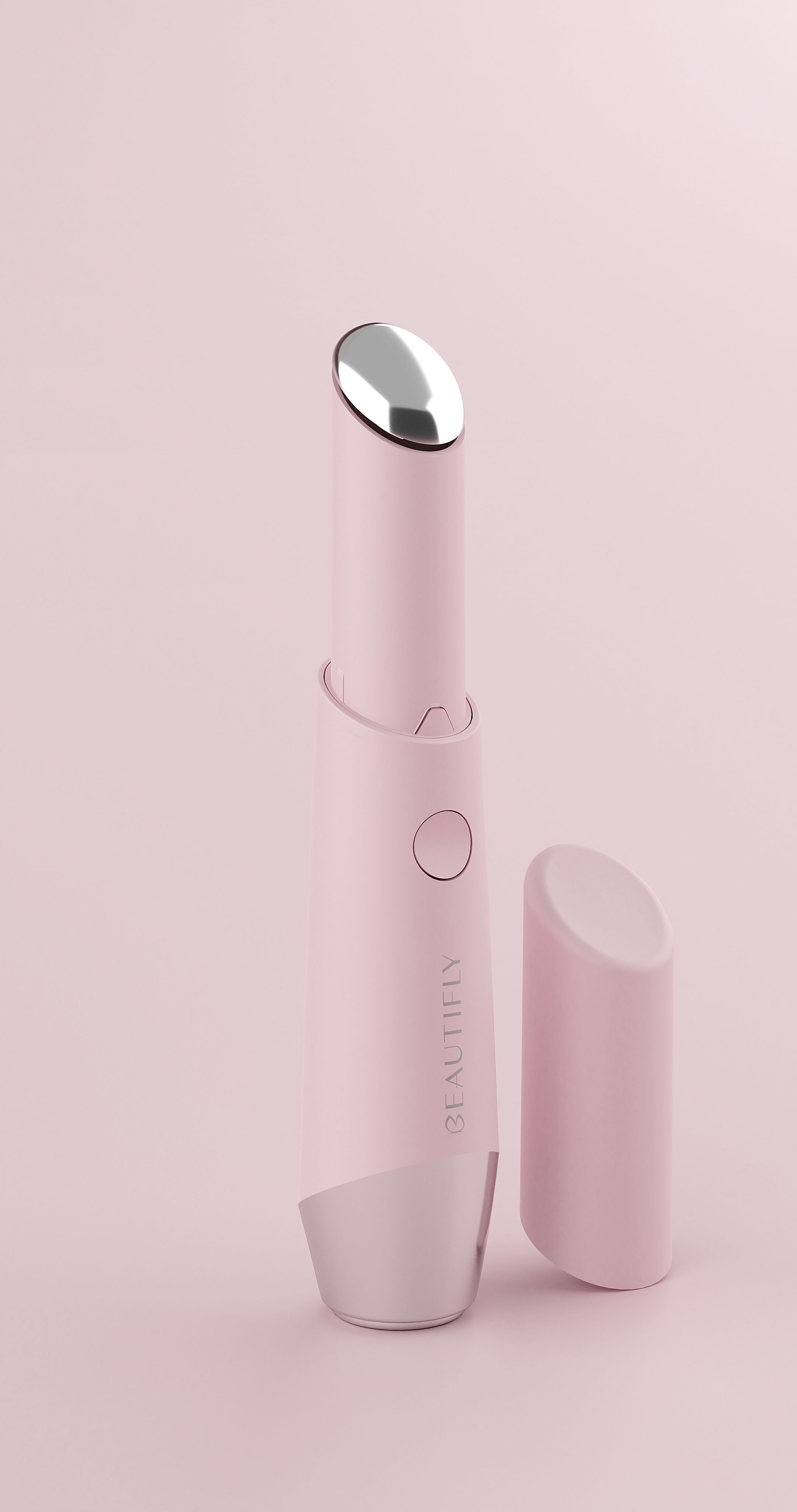 Rosa Gerät mit silbernen Enden und Knopf. Aufschrift BEAUTIFLY. Abnehmbare Kappe daneben. LED-Lichttherapiegerät.
