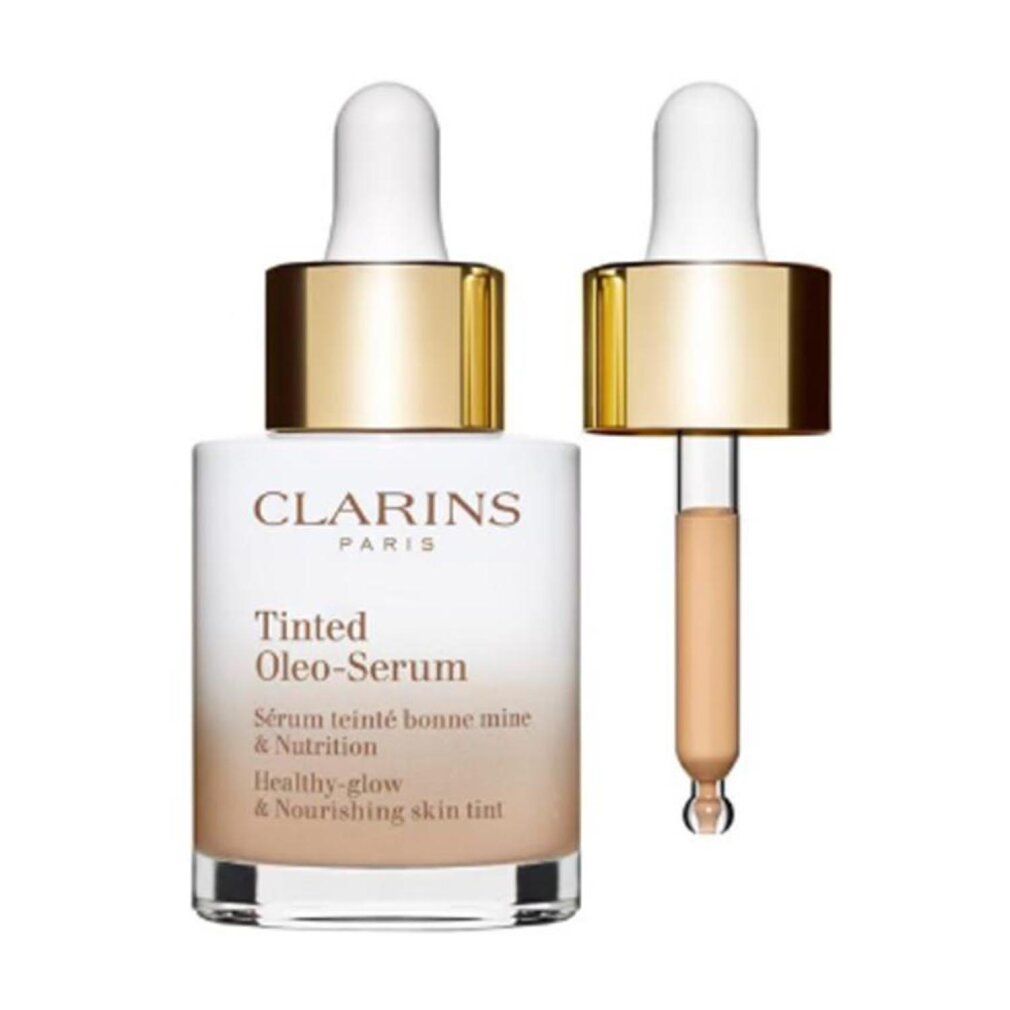 Clarins Tinted Oleo-Serum Flasche mit geöffneter Pipette. Weißes Glas, goldener Deckel, Produktbezeichnung.