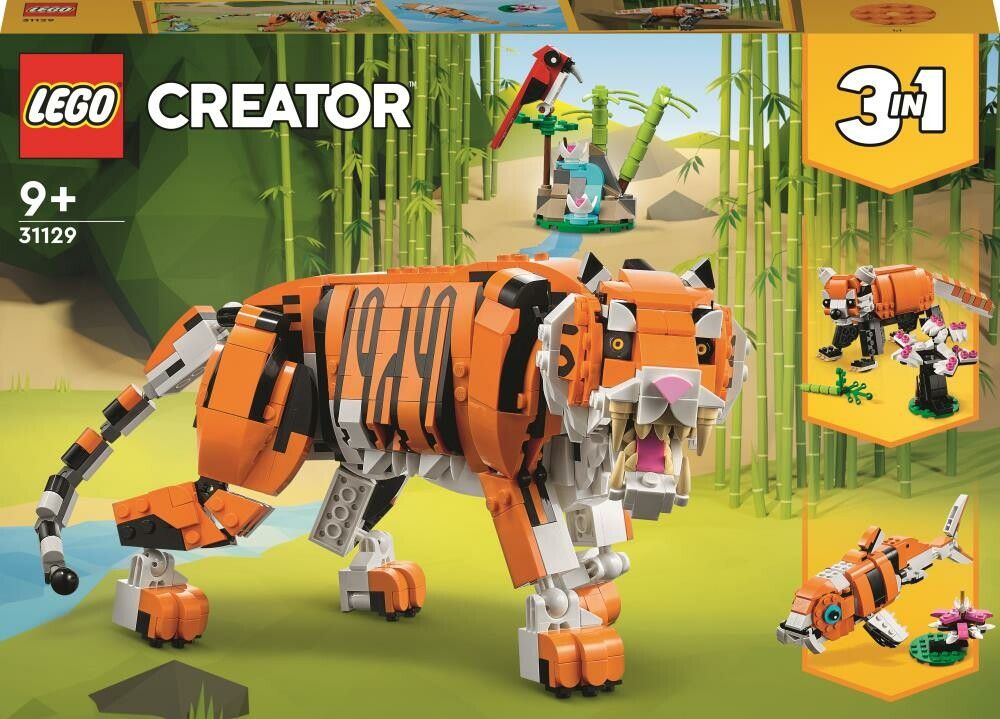 Set LEGO Creator 3 in 1 con una maestosa tigre. Il set include mattoncini per costruire una tigre, un pesce e un uccello rosso. La confezione mostra la tigre in un ambiente giungla. Adatto a bambini dai 9 anni in su.