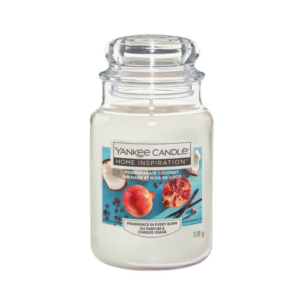 Glasbehälter mit Deckel. Aufkleber mit Text: Yankee Candle Home Inspiration, Granatapfel Kokosnuss. 538g.
