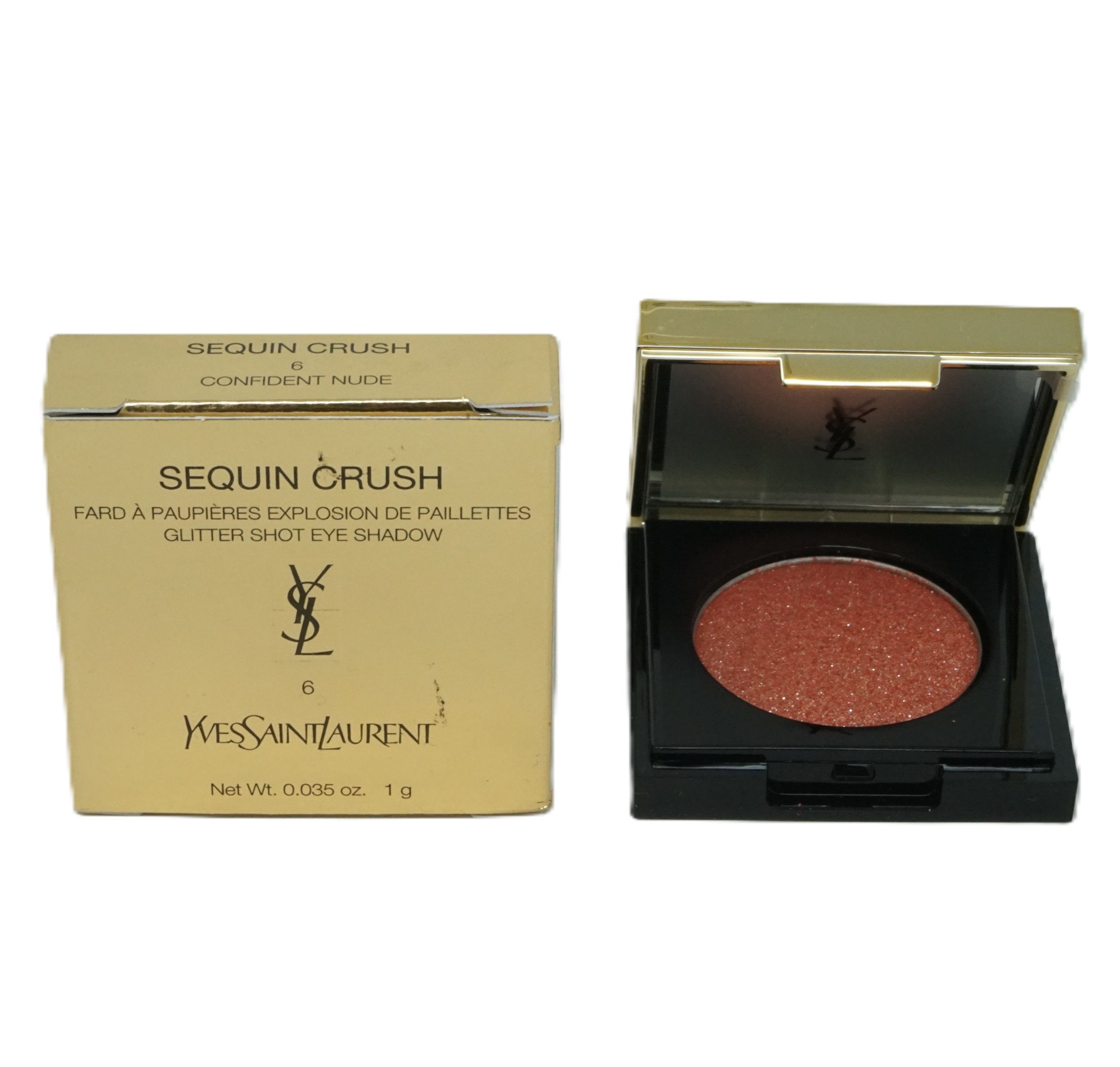 Goldfarbene Verpackung und schwarzer Lidschattenbehälter. Enthält runden, glitzernden Lidschatten. YSL-Logo und Produktname sichtbar.