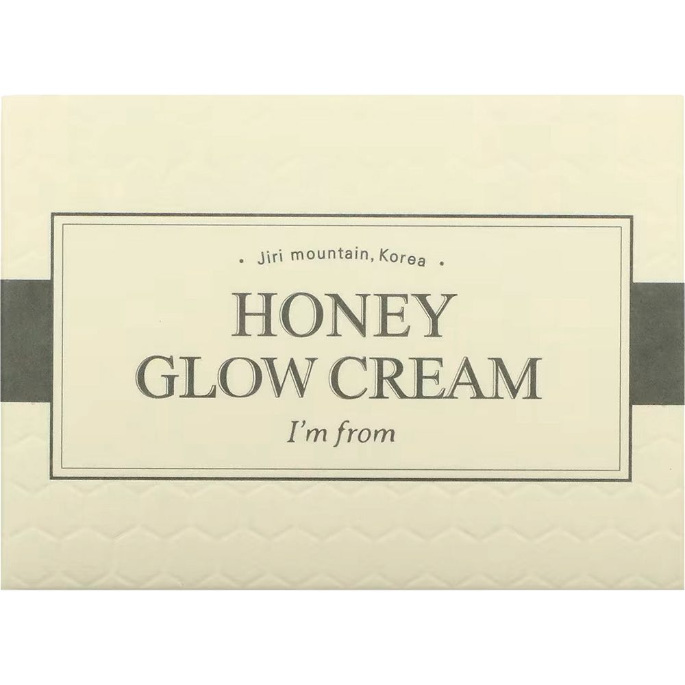 Verpackung mit Aufschrift: HONEY GLOW CREAM, I'm from. Rechteckige Form. Beige Hintergrund.