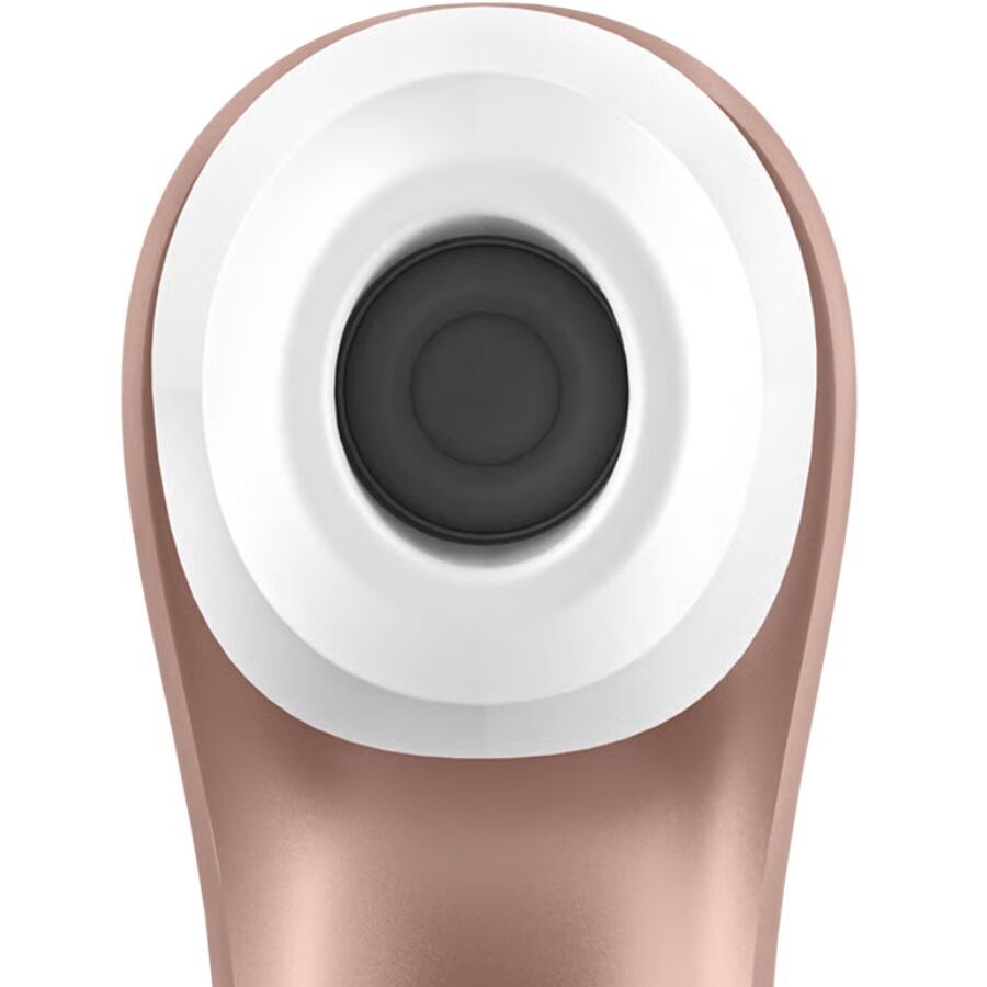 Nahaufnahme des oberen Teils eines roségoldfarbenen Massagegeräts mit weißem und schwarzem Ring.