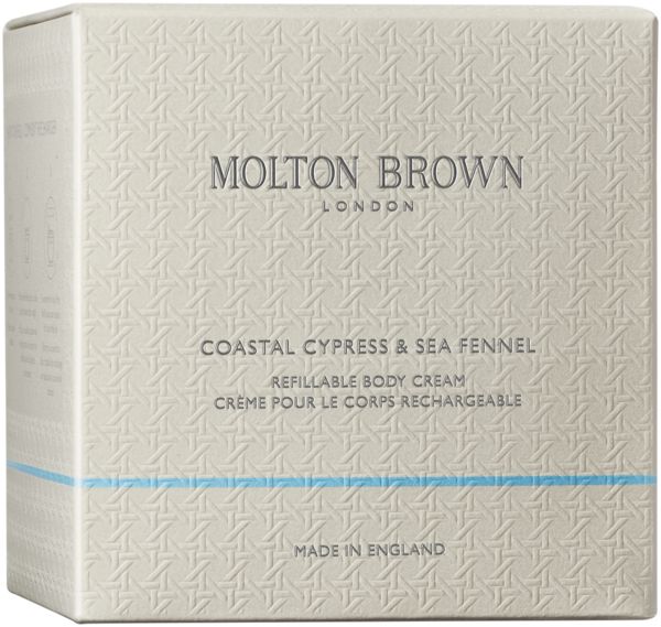 Glasbehälter mit silbernem Deckel. Molton Brown Logo in Silber. Cremefarbener Inhalt sichtbar.