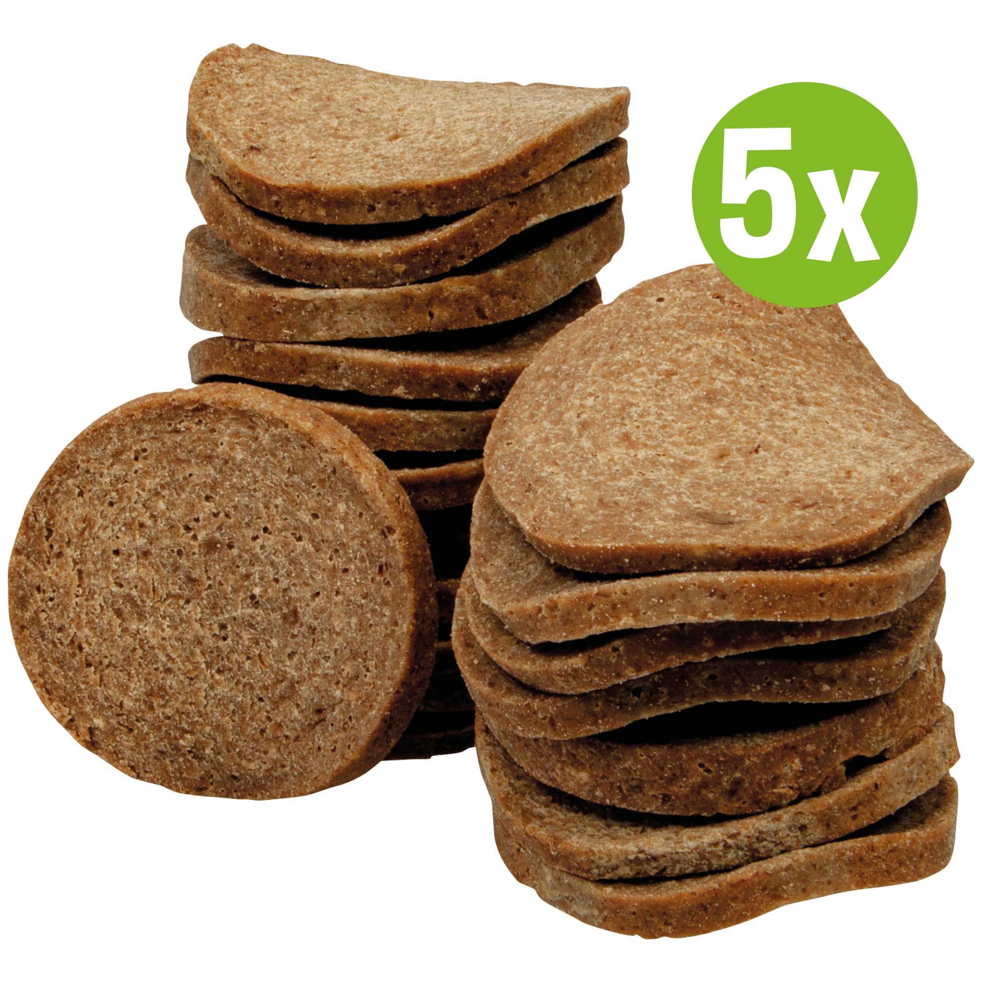 Haufen von Chipies Lamm, krosse Fleisch-Chips-Taler für Hunde. Ein grünes Etikett zeigt "5x".