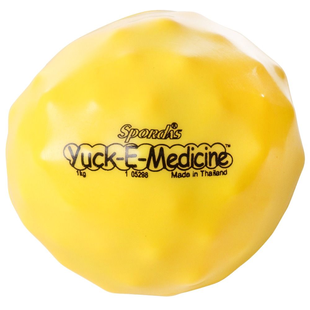 Gelber Medizinball. Aufschrift: Spordas Yuck-E-Medicine, 1kg, Made in Thailand.
