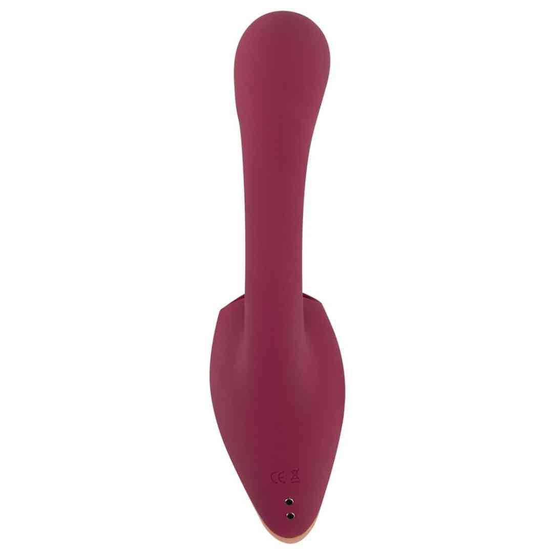 Burgunderfarbener Vibrator. Längliche Form mit abgerundeter Spitze und drei kleinen Punkten am Boden.