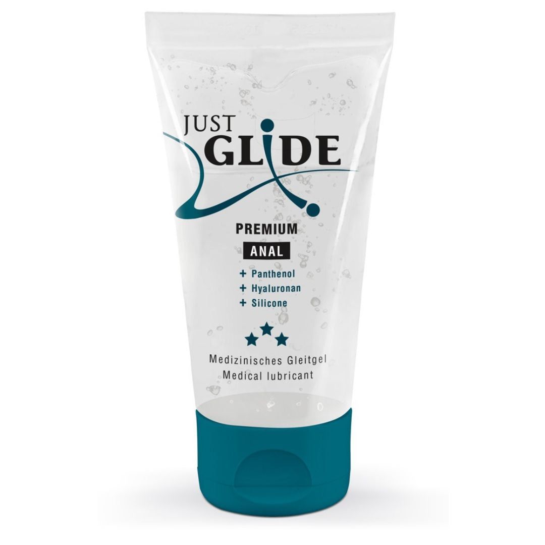 Transparente Tube mit blauem Deckel. Aufschrift: JUST GLIDE PREMIUM ANAL. Enthält Panthenol, Hyaluronan, Silikon. Medizinische Gleitgel.