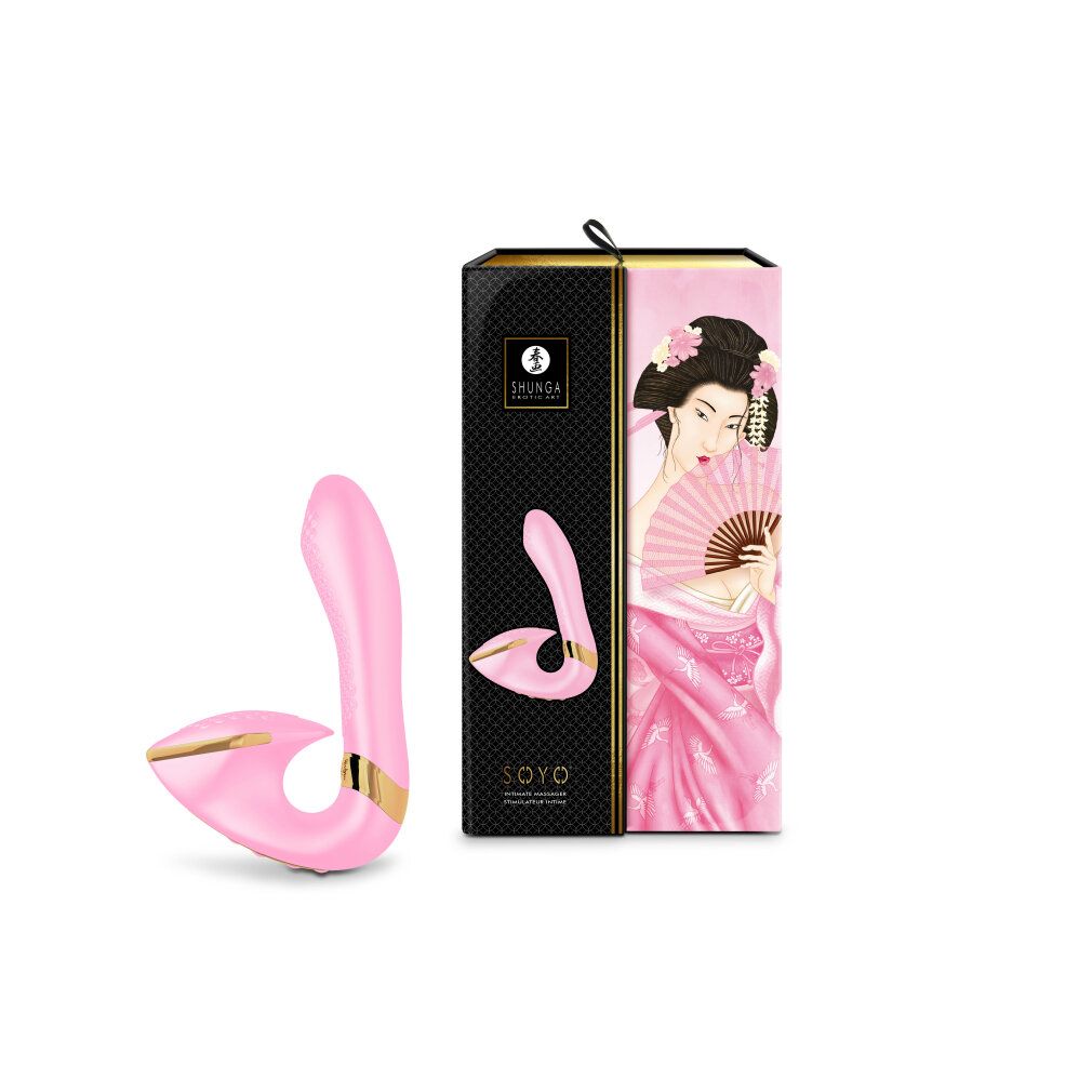 Rosa Vibrator neben einer schwarzen Box mit japanischem Design. Goldfarbene Akzente.