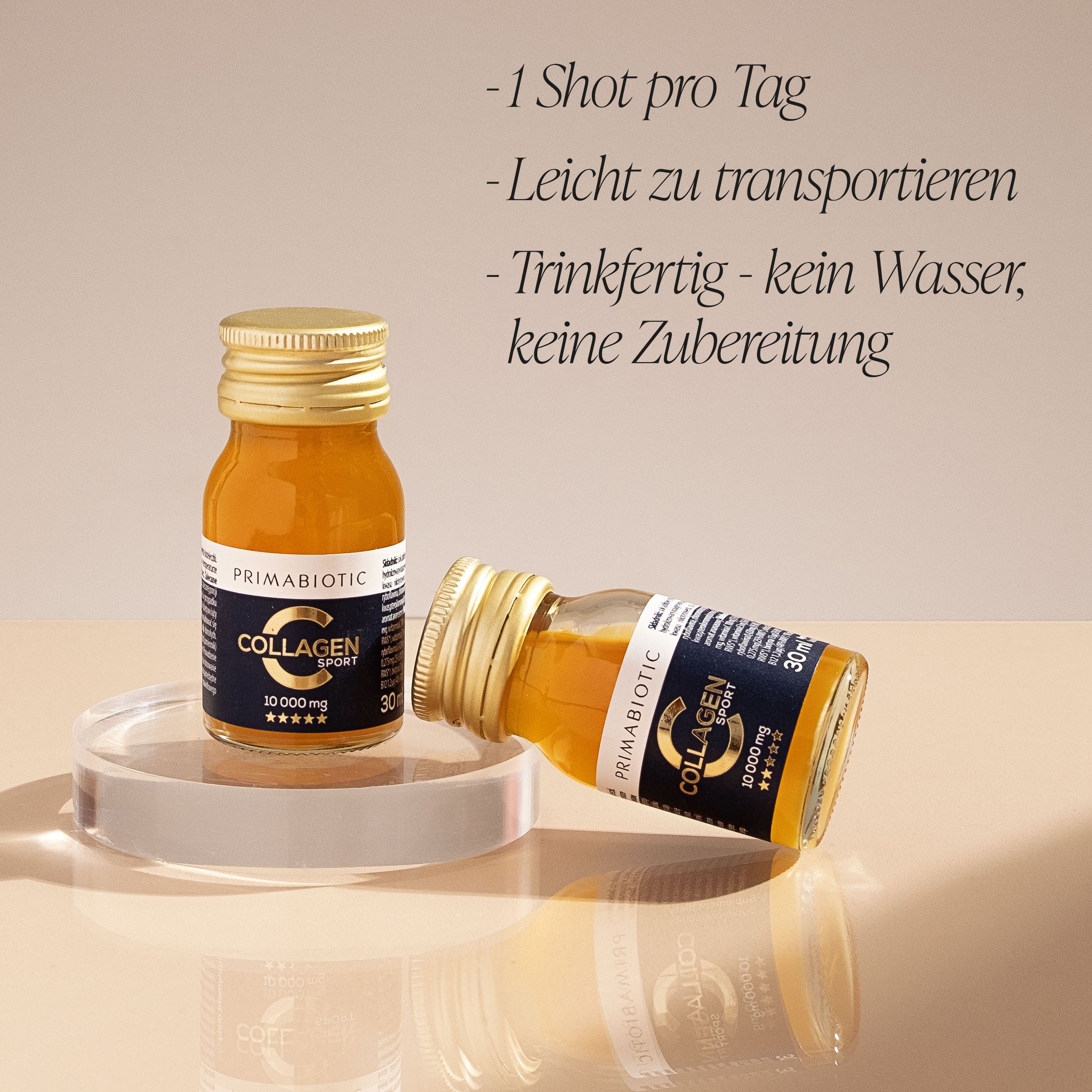Zwei kleine Flaschen Primabiotic Collagen Sport. Goldfarbener Deckel. Aufschrift: 10.000 mg.