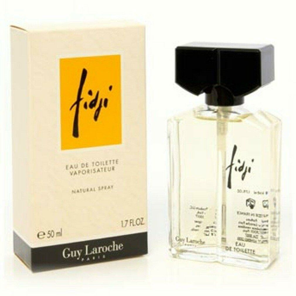 Fidji Eau de Toilette Spray von Guy Laroche. Flakon und Verpackung. Gelbe Flüssigkeit im Glasflakon mit schwarzem Verschluss.