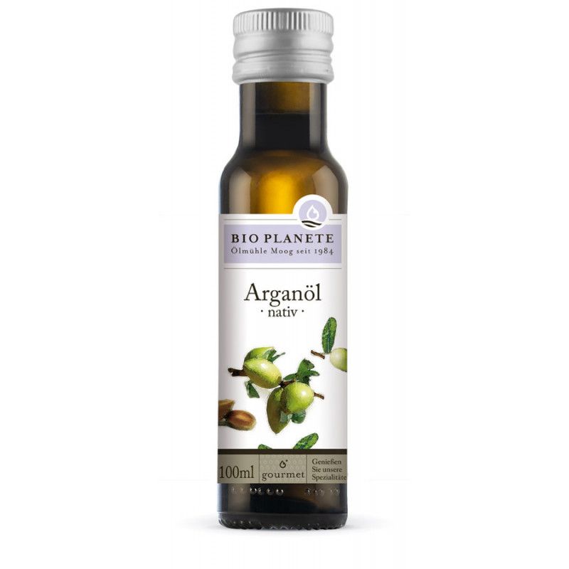 Arganöl-Flasche mit Etikett. Aufschrift: Bio Planete, Arganöl nativ. Abbildung von Arganfrüchten.
