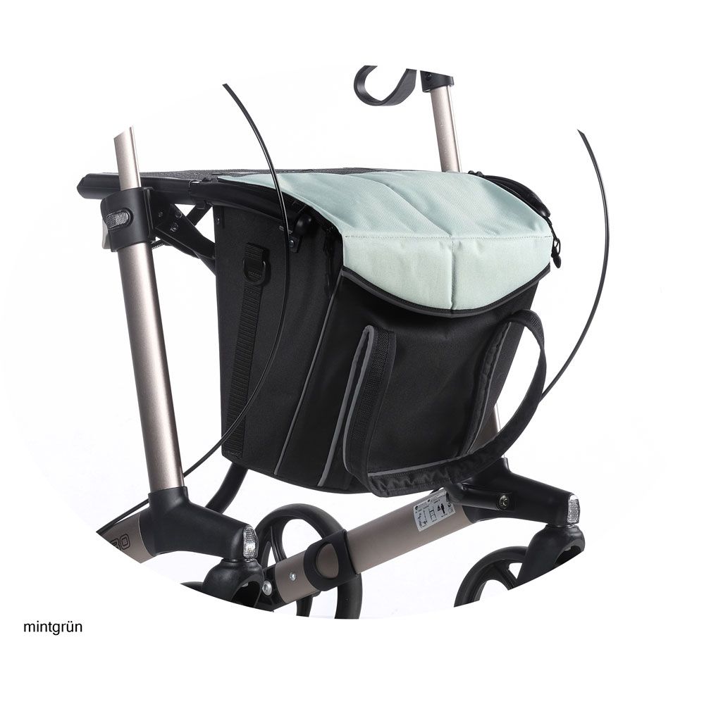 Schwarze Tasche mit mintgrüner Abdeckung an einem Rollator. Graue Details und Halterungen.