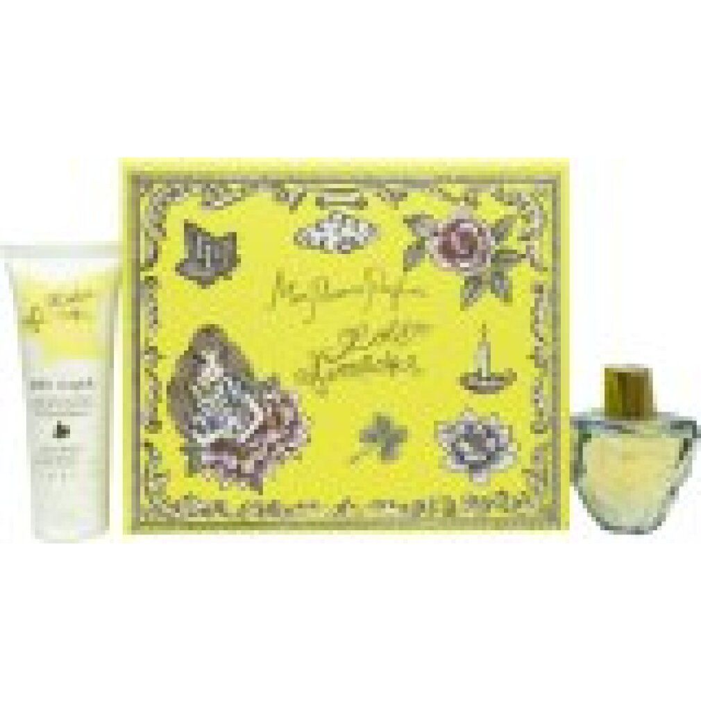 Gelbes Geschenkset mit Flakon und Tube. Flakon mit goldener Kappe. Tube mit Schriftzug. Blumenmuster auf der Verpackung.