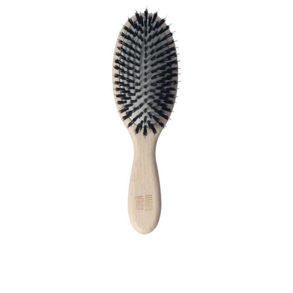 Haarbürste mit ovalem Bürstenkopf und Holzgriff. Schwarze Borsten. Griff mit Schriftzug Marlies Moller.