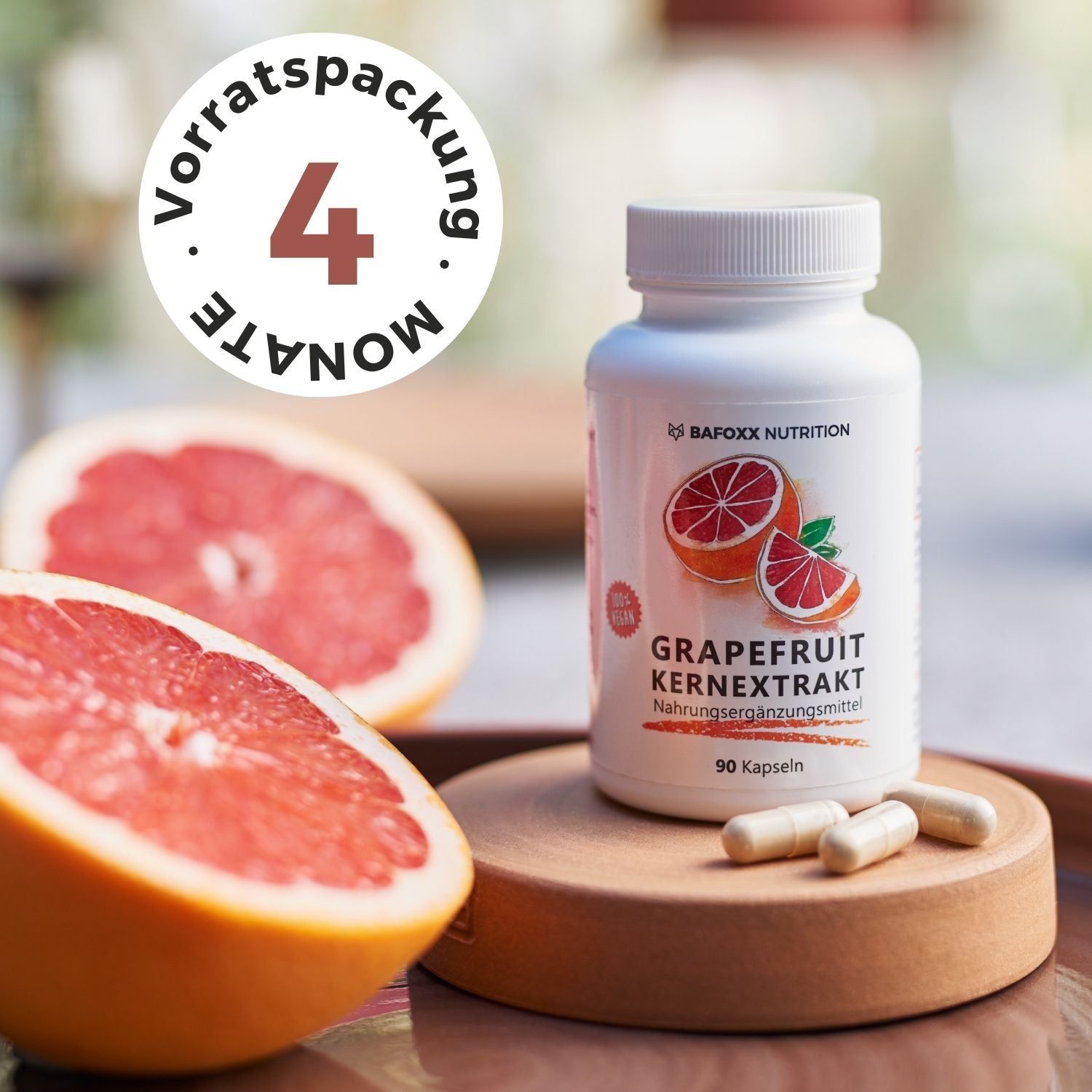 BAFOXX Nutrition® Kapseln. Kapseln, Grapefruit-Hälften und Flasche. Text: Grapefruit Kernextrakt. 90 Kapseln. 4 Monate Vorrat.