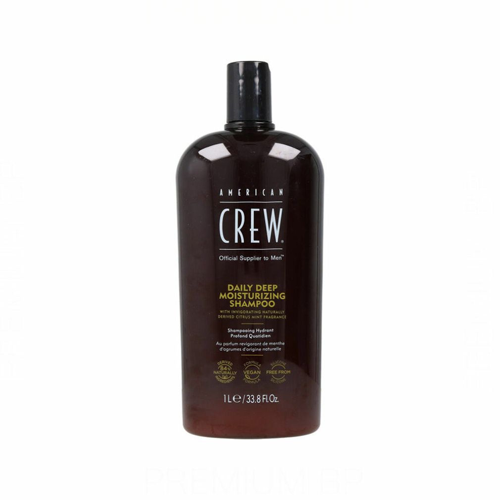 Braune Flasche American Crew Shampoo. Schwarzer Deckel. Text: Daily Deep Moisturizing Shampoo. 1L/33.8 fl oz.
