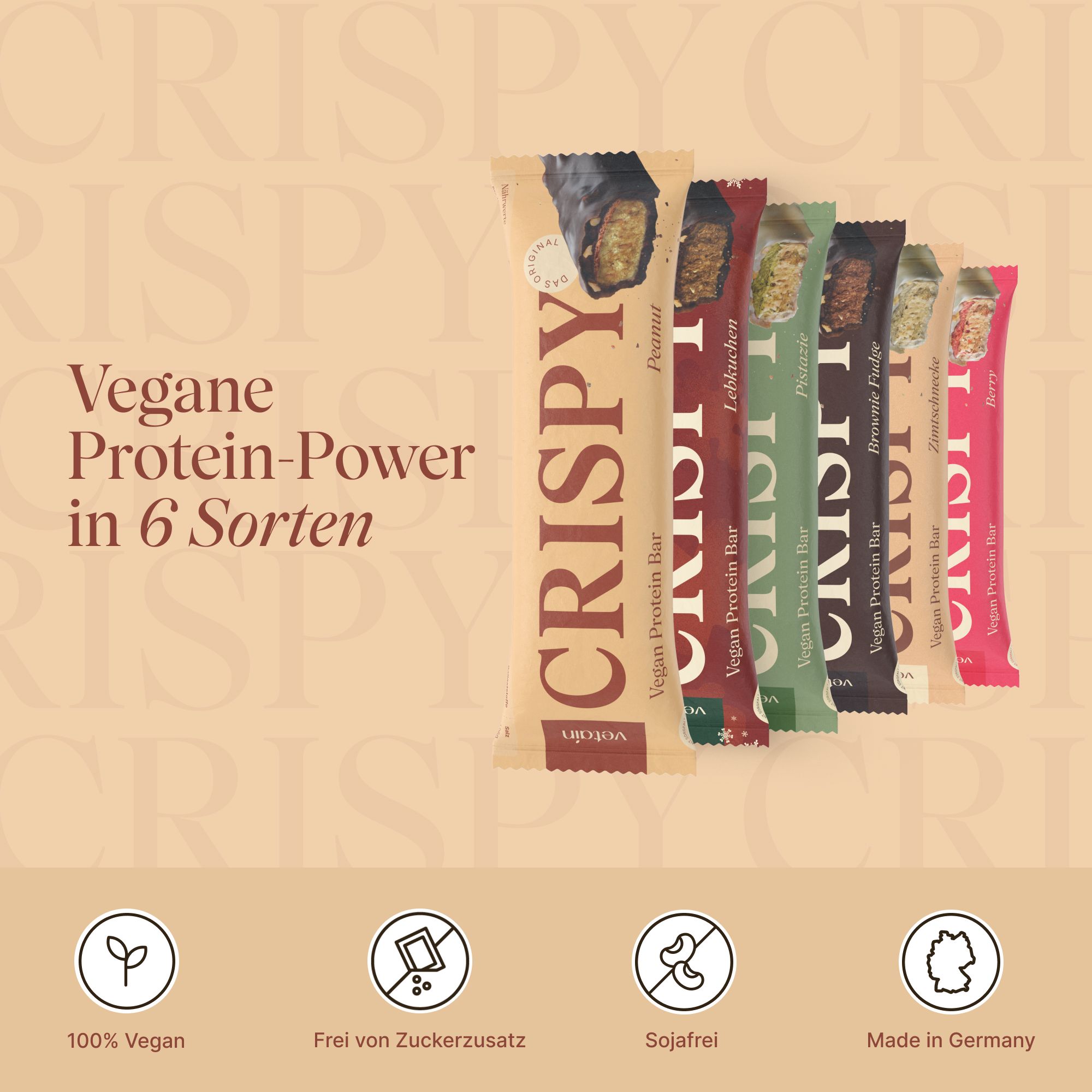 Sechs Proteinriegel in verschiedenen Geschmacksrichtungen. Verpackung mit Aufschrift "CRISPY". Vegan, ohne Zuckerzusatz, sojafrei, hergestellt in Deutschland.