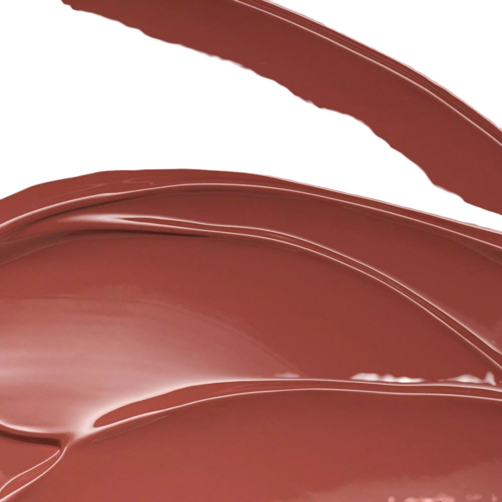 Nahaufnahme von Lippenstift-Swatches. Verschiedene Farbtöne in Rot- und Brauntönen. Glänzende Textur.