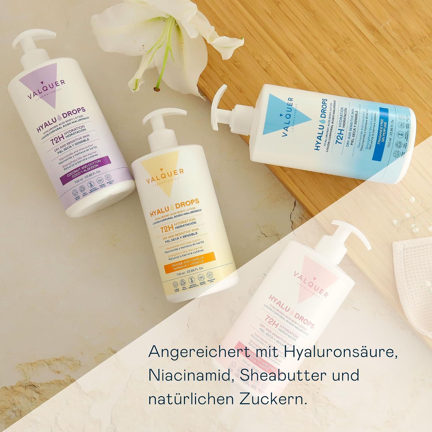 Vier Valquer Hyalu Drops Körperlotion-Flaschen mit Pumpspendern in verschiedenen Farben.
