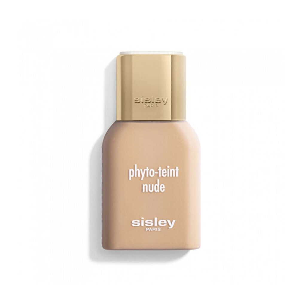 Sisley Phyto-Teint Nude Flasche. Beige Flüssigkeit, goldfarbener Deckel. Text: Phyto-Teint Nude, Sisley Paris.