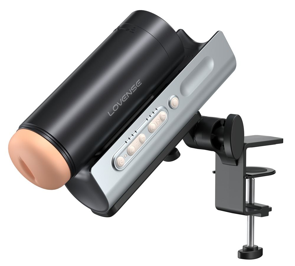 Schwarzes Gerät mit beigem Einsatz, silberner Basis mit Knöpfen. Tischhalterung.