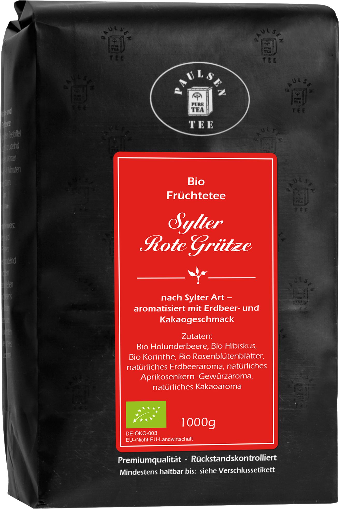Schwarze Verpackung mit rotem Etikett. "Paulsen Tee" Logo. "Sylter Rote Grütze Früchtetee" Text. Bio-Siegel. 1000g.