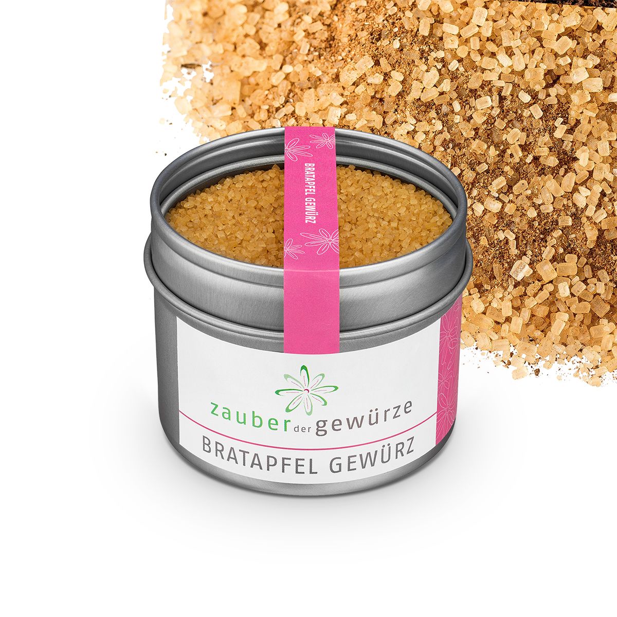 Runde Dose mit Bratapfel Gewürz. Rosa Etikett mit Schriftzug. Gewürz daneben. Weißes Etikett mit Logo und Produktname.
