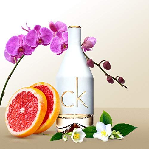 Parfümflasche mit Orchideen, Grapefruit und Jasminblüten.