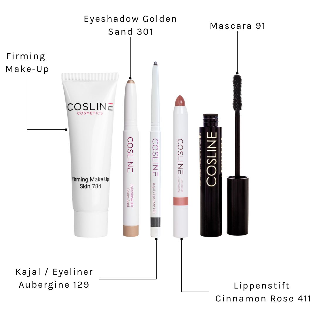 Kosmetikprodukte mit Beschriftungen: Kajal, Eyeliner, Lidschatten, Lippenstift, Mascara und Make-up-Creme.