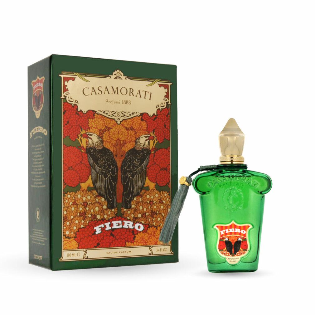 Grüne Glasflasche mit goldener Kappe und Quaste. Daneben eine grüne Schachtel mit floralem Design und dem Schriftzug „Fiero“.