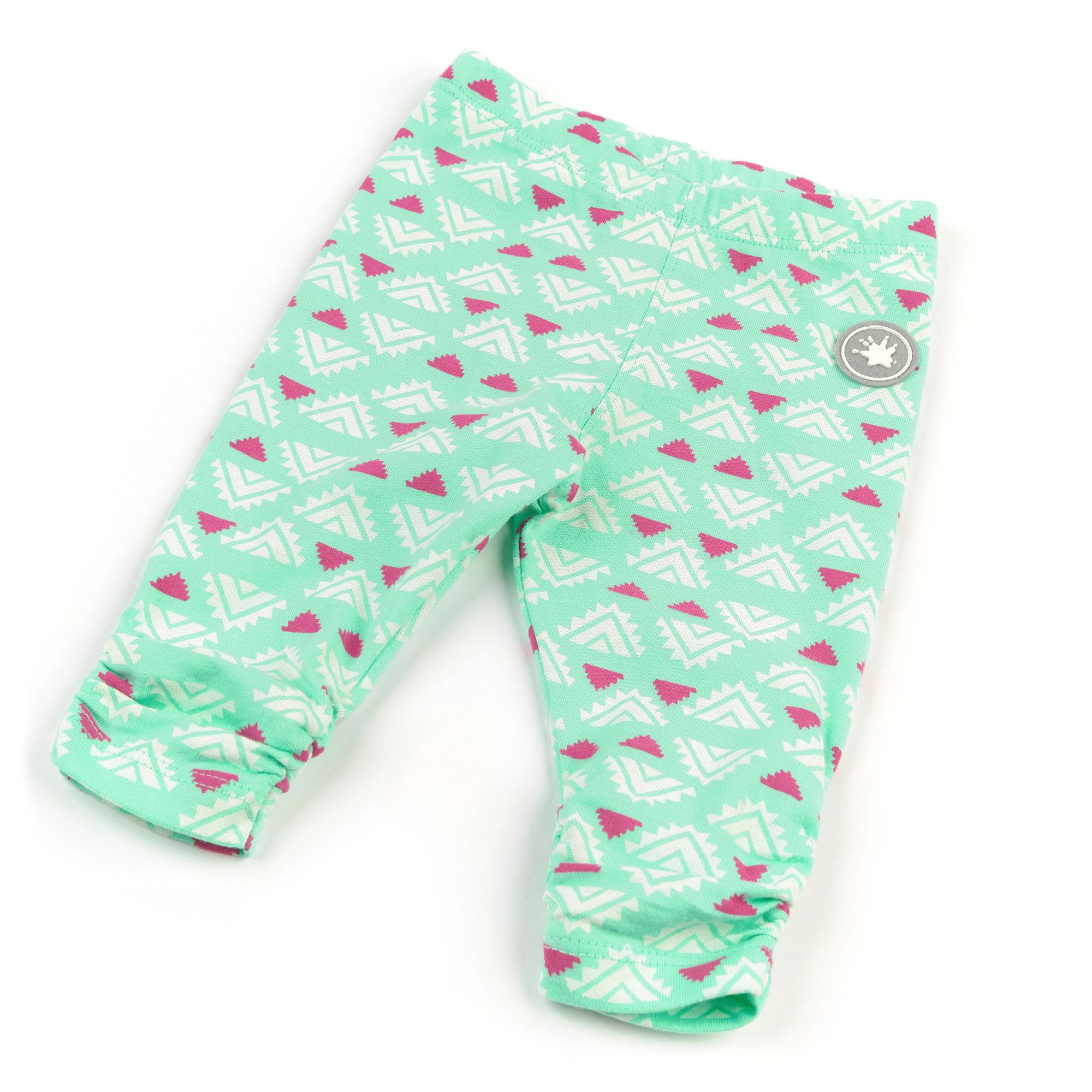 Hellgrüne Baby-Leggings mit weißem und pinkfarbenem Muster. Gerüschter Saum. Logo am Bein. Schräge Ansicht.