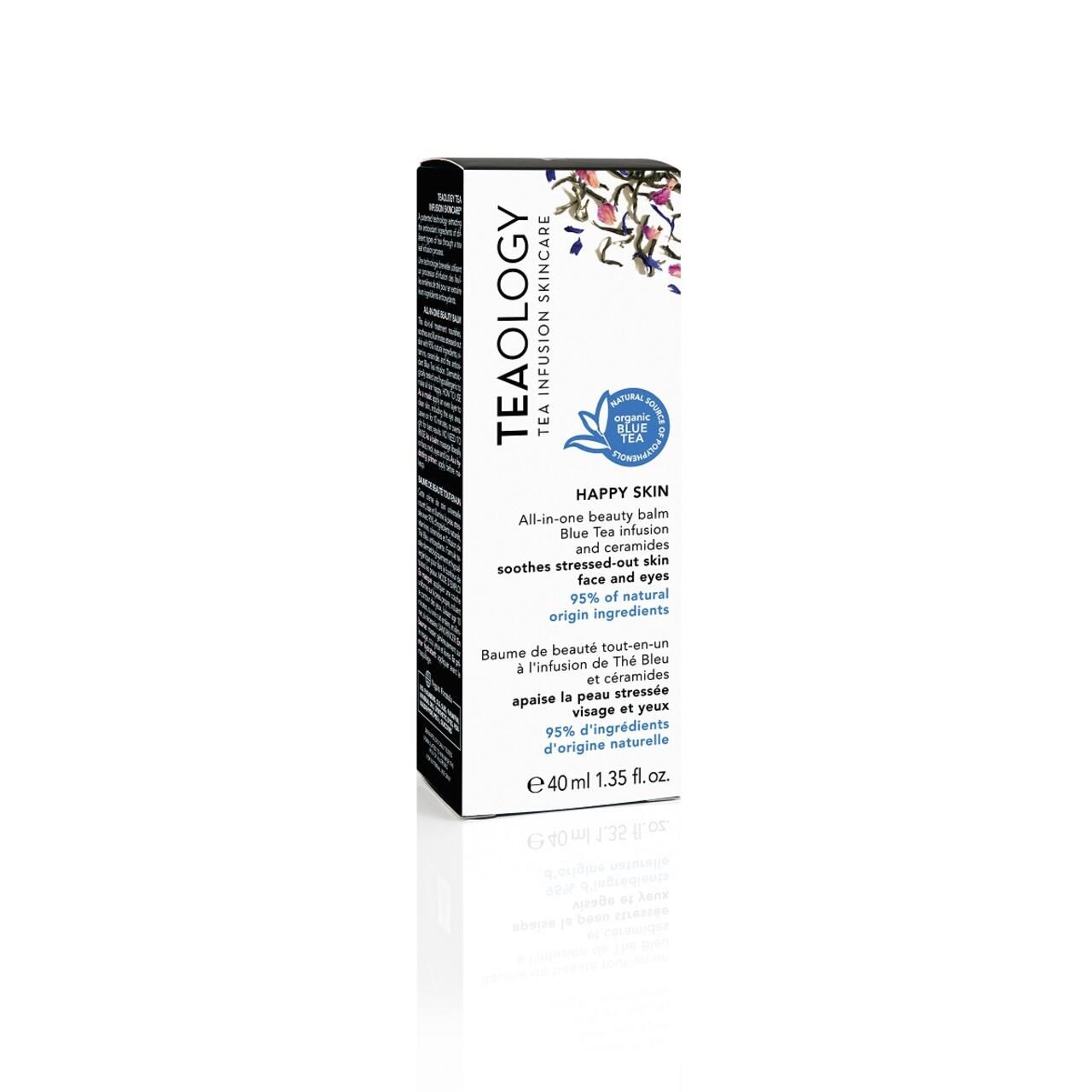 Schwarze Verpackung mit Aufschrift: Teaology, Happy Skin, All-in-one beauty balm. Blaue Blume. 95% natürliche Inhaltsstoffe.