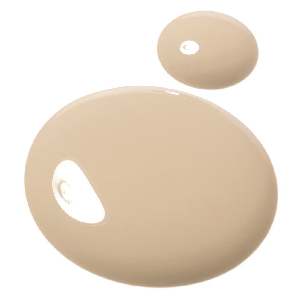 Zwei Tropfen Foundation. Farbton: Medium-Cool. Runde Form, helle Farbe.