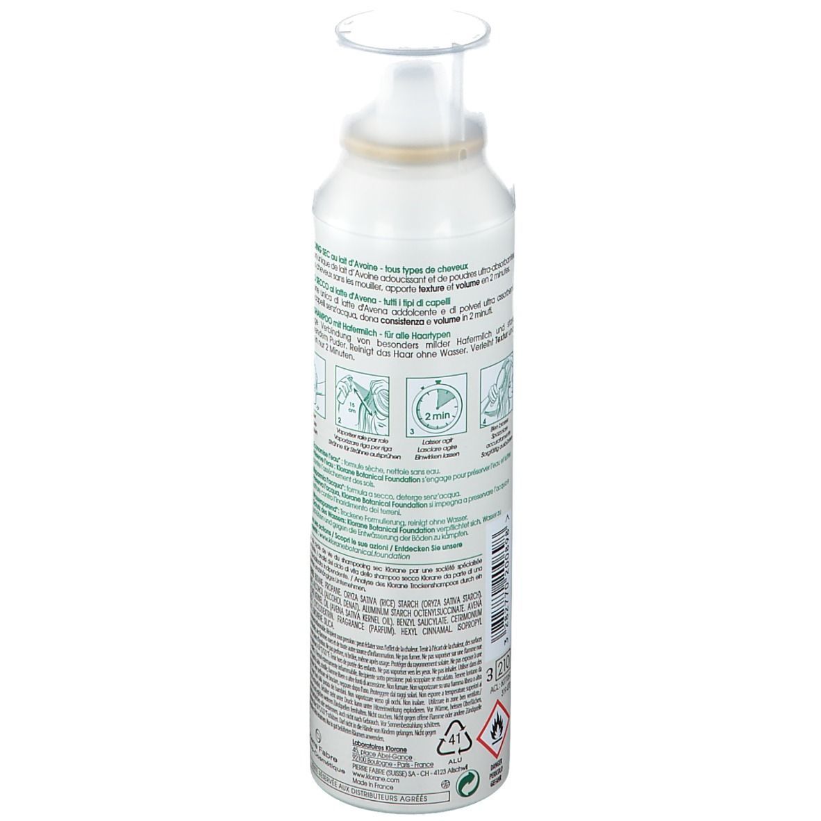Weißes Spray mit Sprühkopf. Text auf Etikett: Trockenshampoo, Hafermilch, Volumen. Mit Illustrationen zur Anwendung.